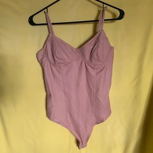 Large bodysuit. Fake leather material. Pink.